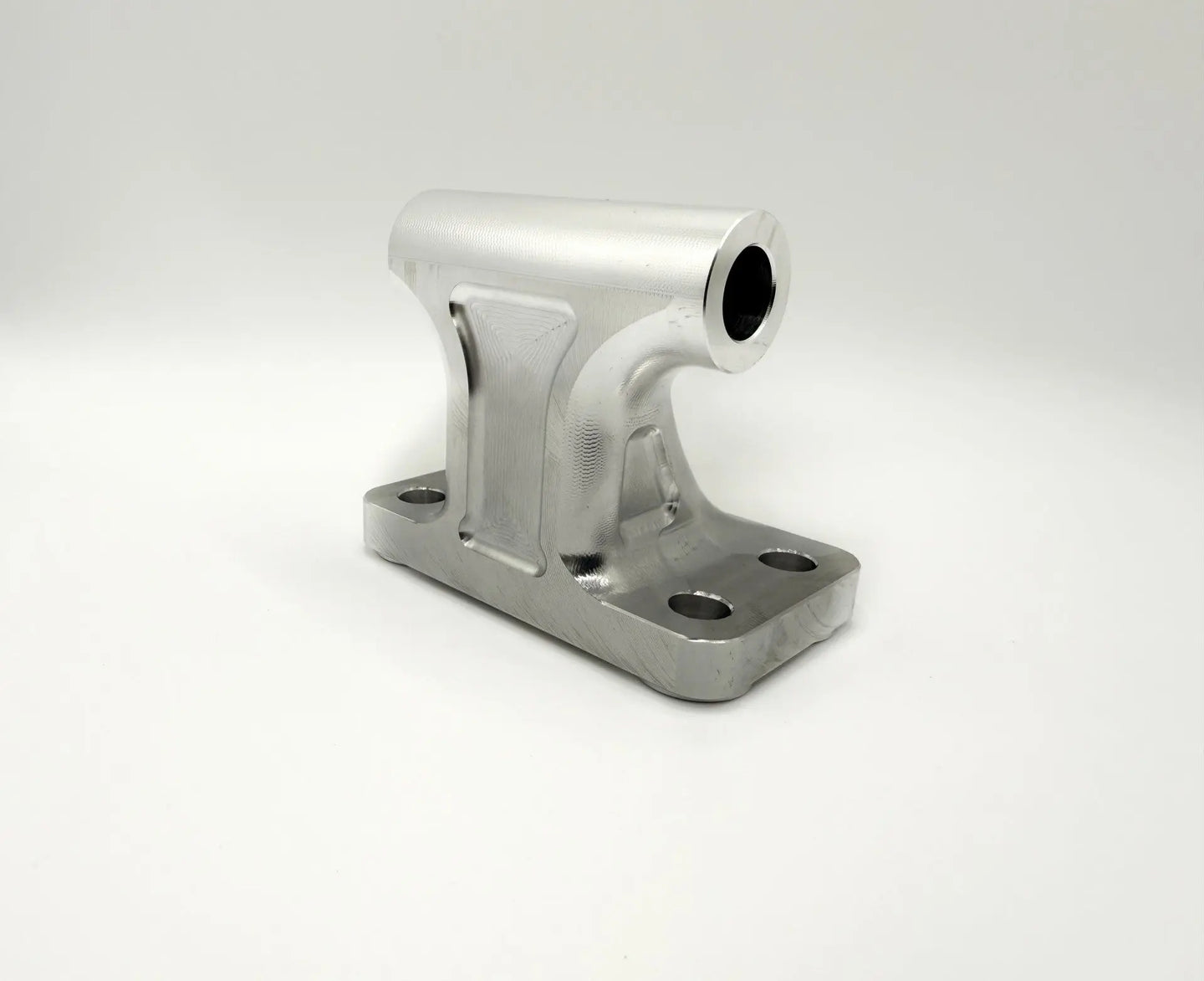 Angled billet alternator mount for 2003–2018 Cummins 5.9L and 6.7L, CNC finish with mounting holes visible