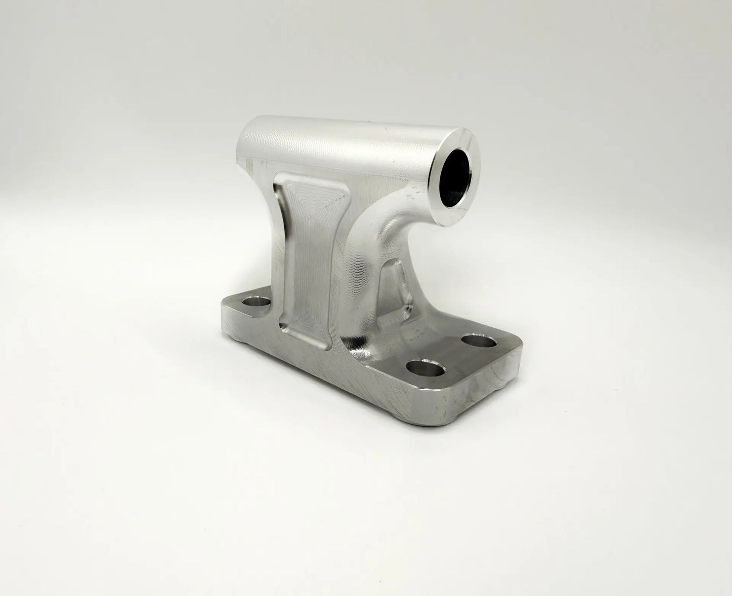 Angled billet alternator mount for 2003–2018 Cummins 5.9L and 6.7L, CNC finish with mounting holes visible